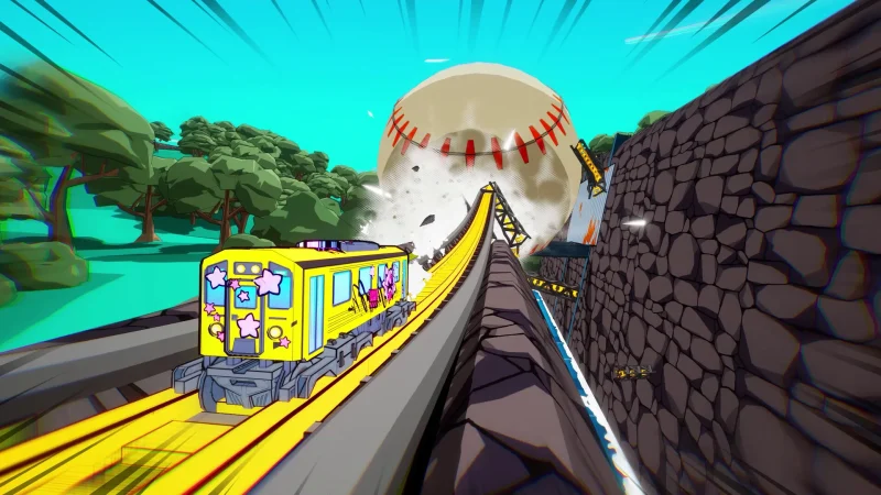 A yellow train grinds along a curved rail past a giant baseball in Denshattack!