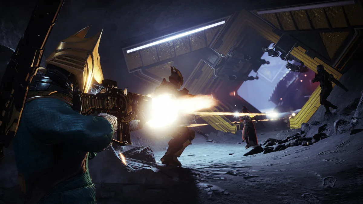 A Guardian fires at enemies in a dark ruin in Destiny 2