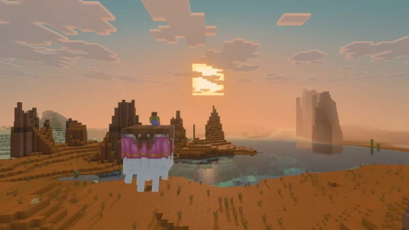 A player rides a large flying mob over a badlands lake at sunset in Minecraft