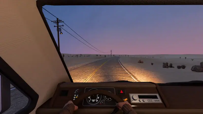 The view from the RV driver's seat on a desert highway at dusk in Nomad Drive