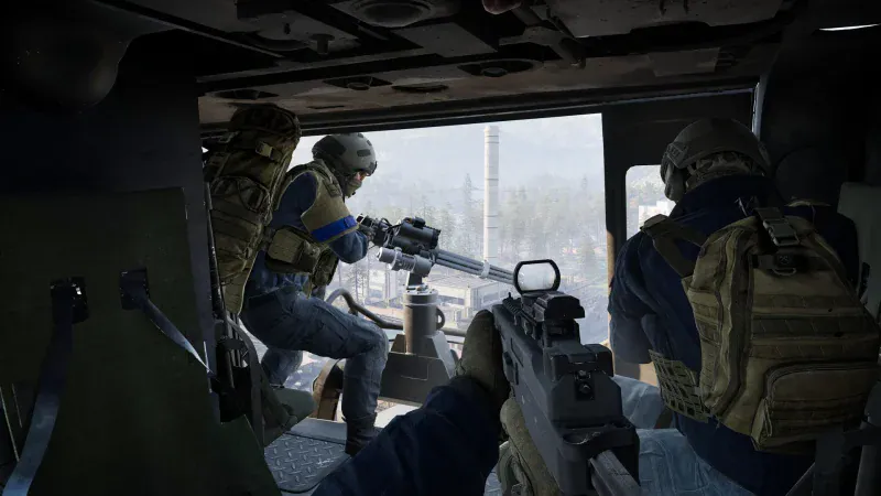 Soldiers ride in the back of a transport helicopter with a door gunner in WARDOGS